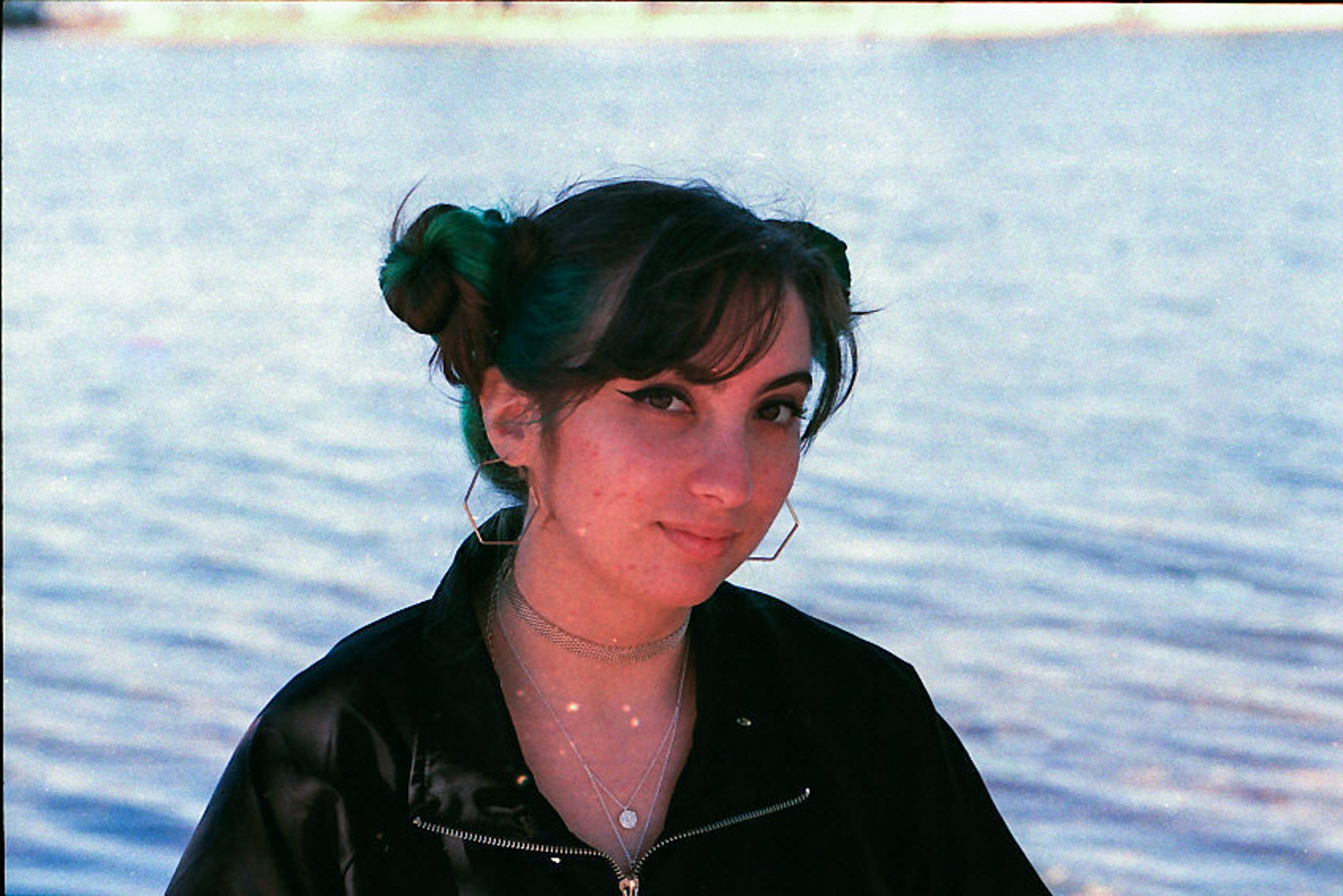Film-inspired portrait near water